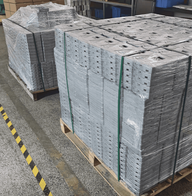 Metal parts manufactured in bulk, placed on pallets