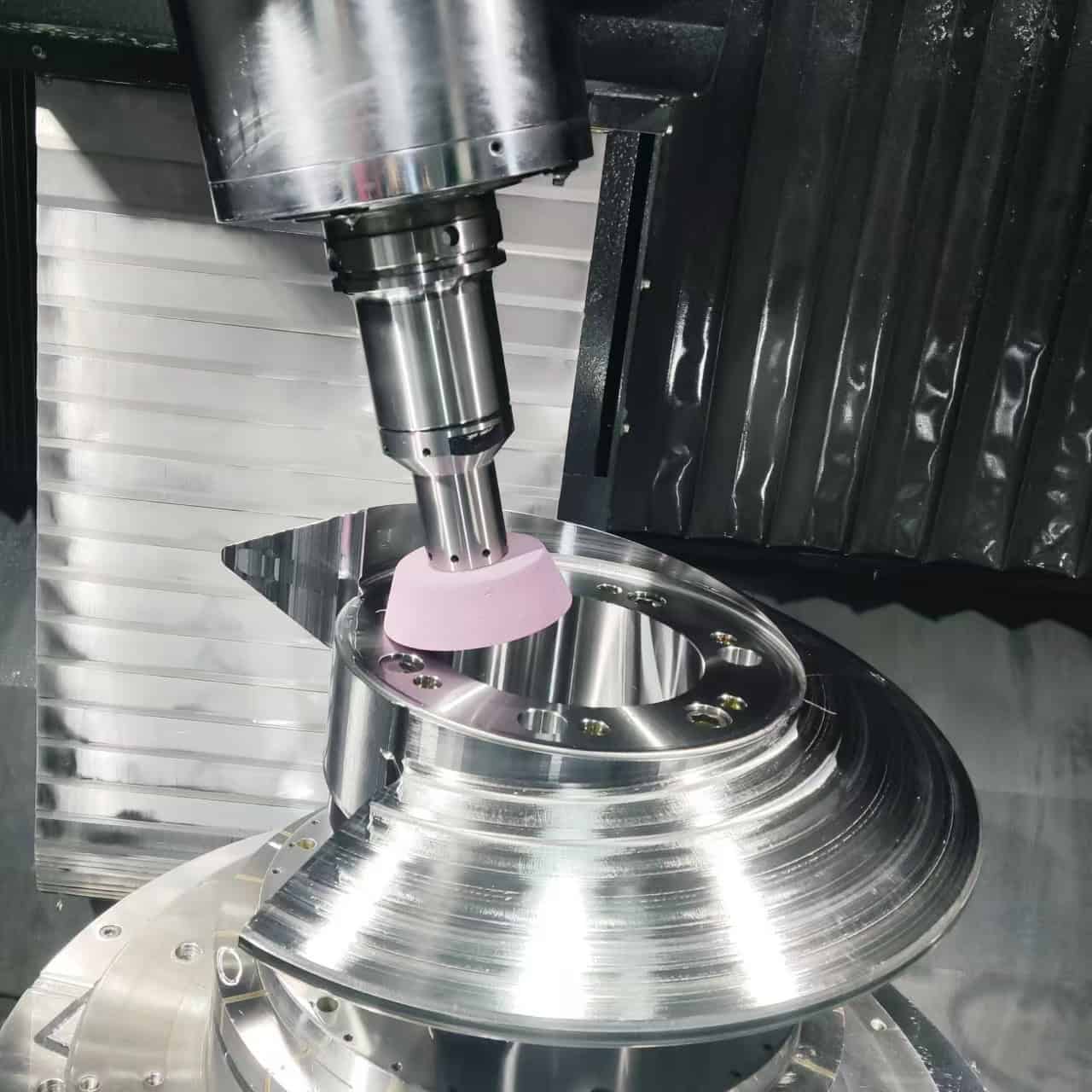 Precision parts currently undergoing grinding