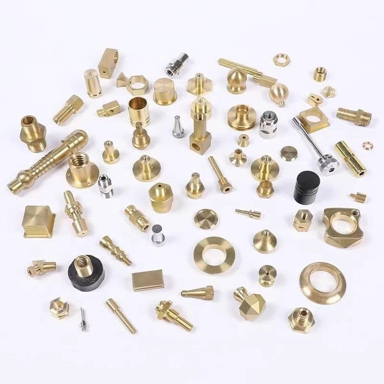 Precision CNC machined metal parts in gold, silver, and black finishes, various shapes and sizes.