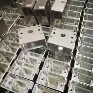 Precision CNC machined metal enclosures with drilled holes and smooth finishes.