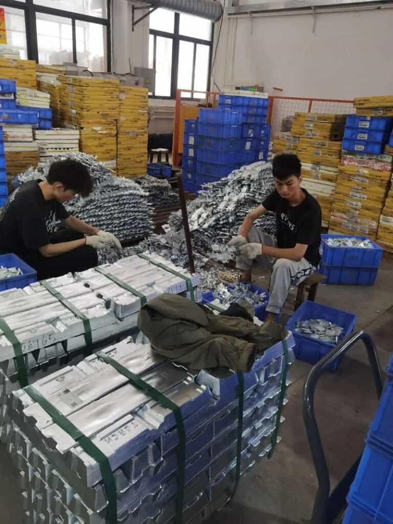 High-precision CNC machining parts being assembled in a manufacturing facility.