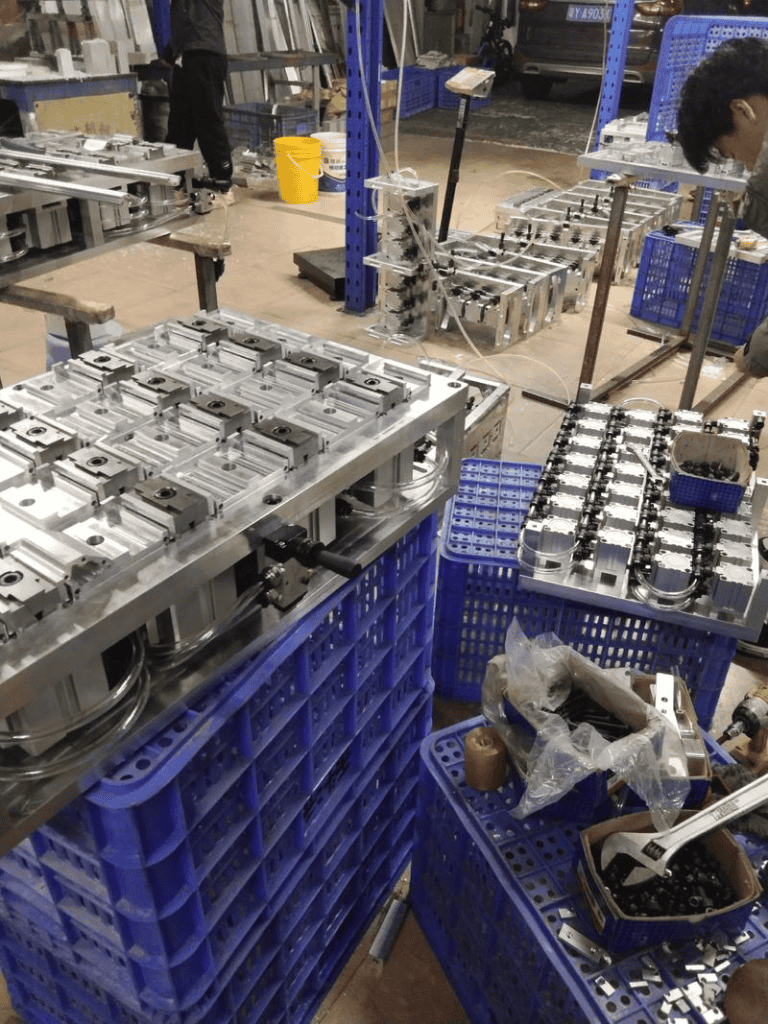 Precision CNC machined metal parts in a manufacturing workshop.