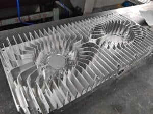 Aluminum CNC machined heat sink with fins for electronic cooling applications.