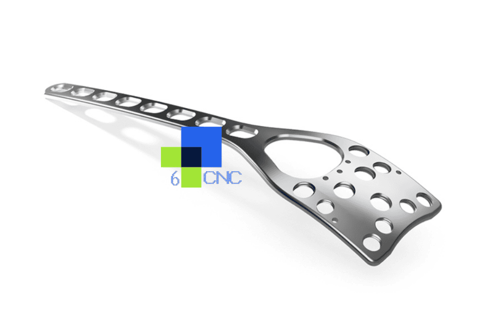 Custom CNC machined metal part with multiple holes and cutouts.