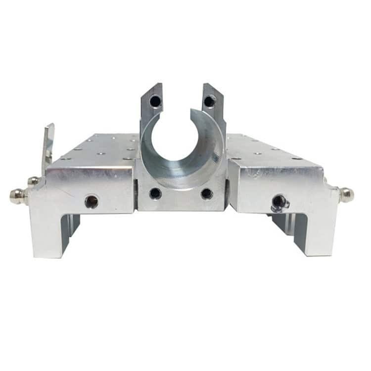 Precision CNC machined metal component with circular clamp for industrial use.