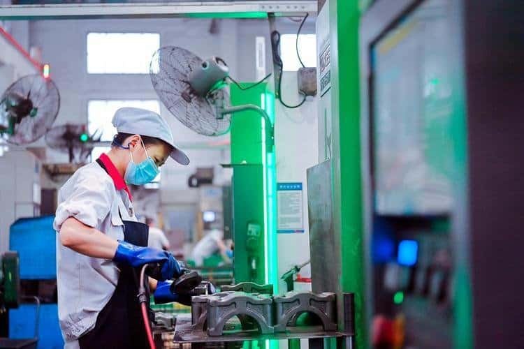 Workers are hand-polishing parts
