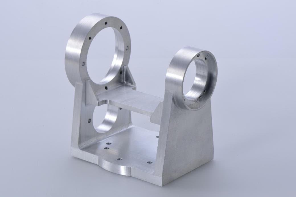 A support bracket designed to bear the weight of industrial equipment; this bracket is CNC-machined