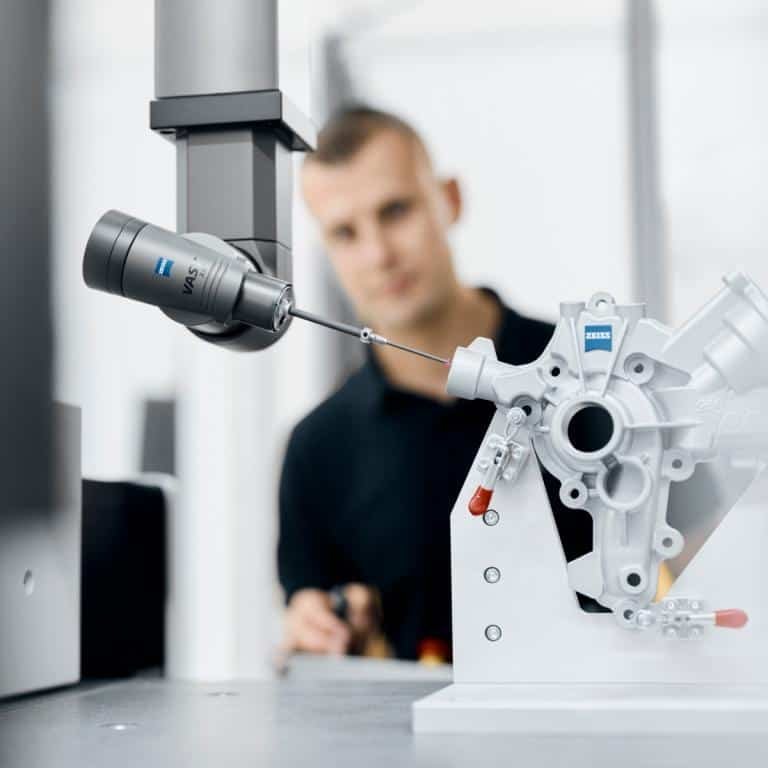 Coordinate measuring machine inspecting a complex housing