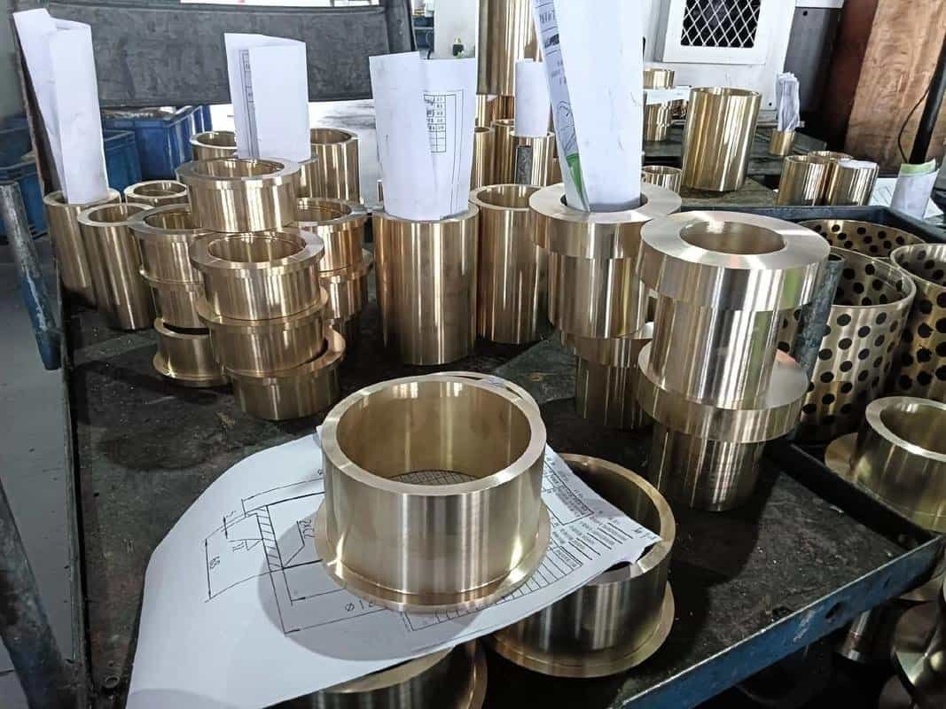Machined brass flange components with bolt holes and locating bores