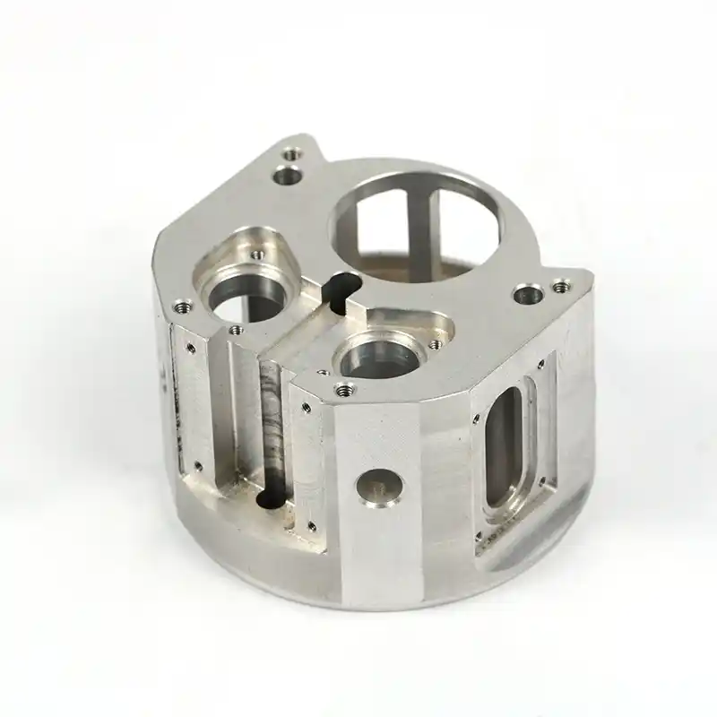 Multi-face machined metal housing with bores and pockets