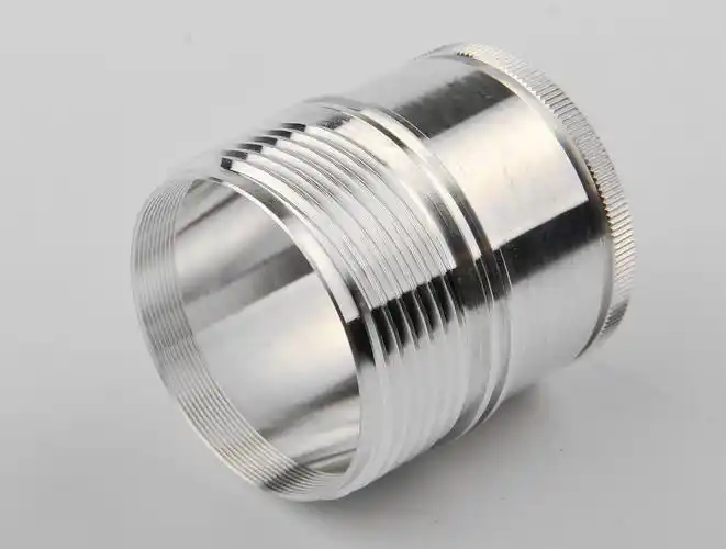 Turned metal sleeve with external threads and knurled edge