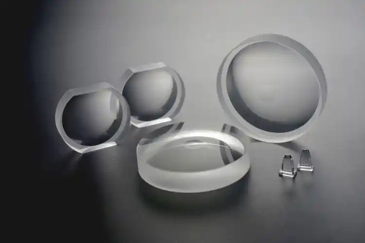 Optical lenses and prisms