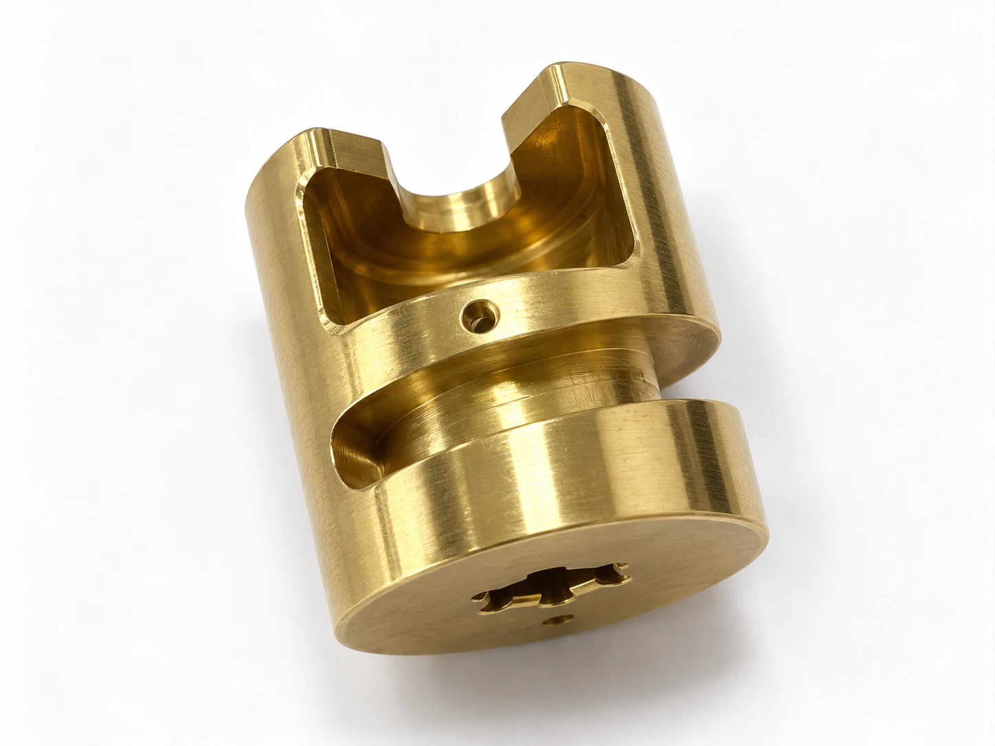 Brass component with milled slots and drilled holes