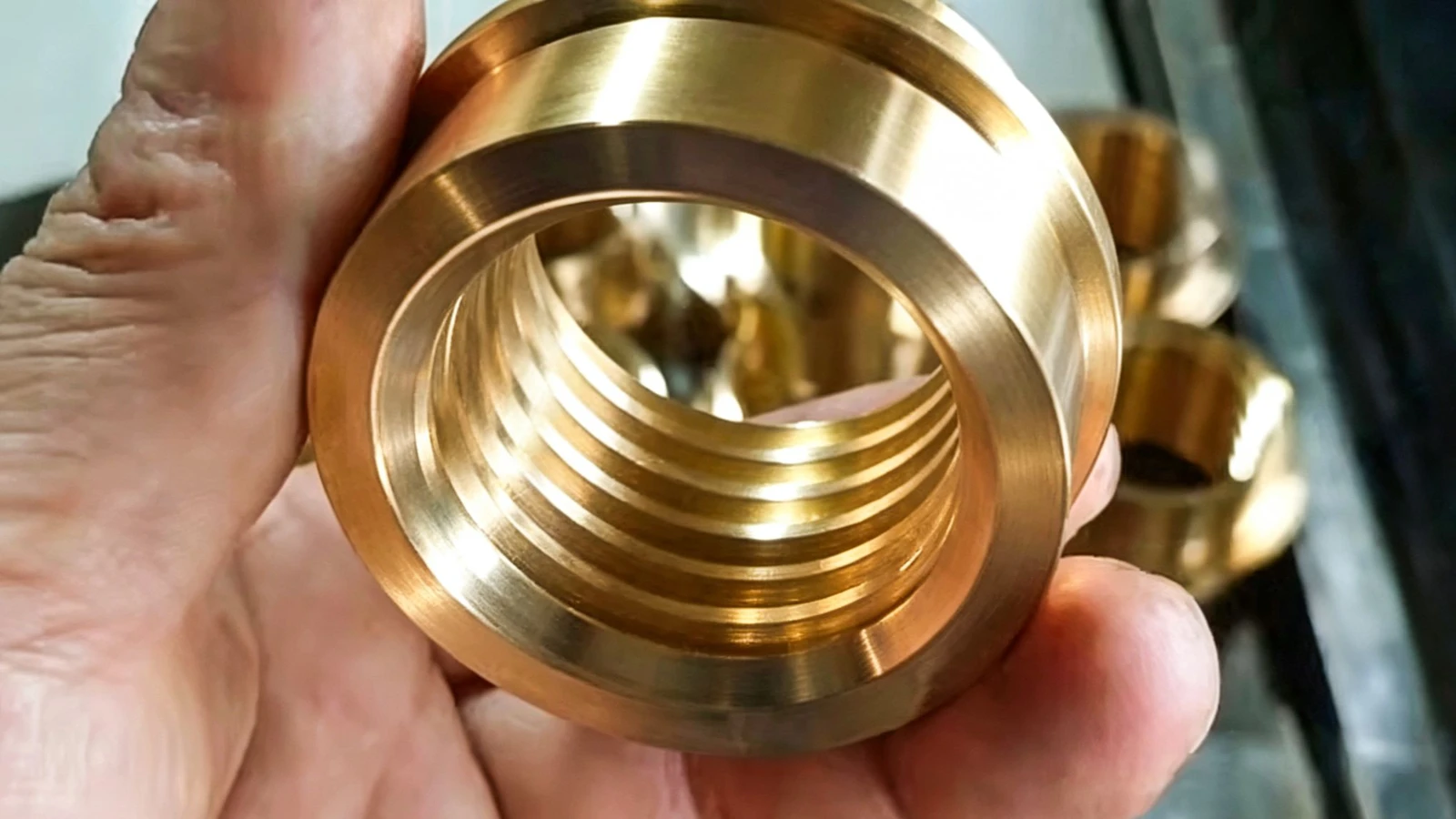 Large threaded brass fitting with a machined flange
