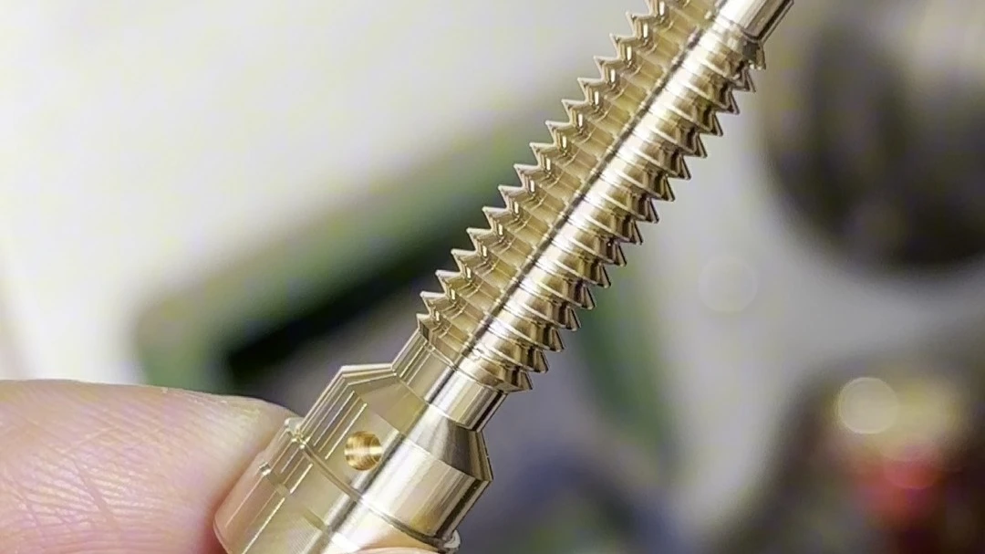 Brass threaded shaft showing detailed thread geometry