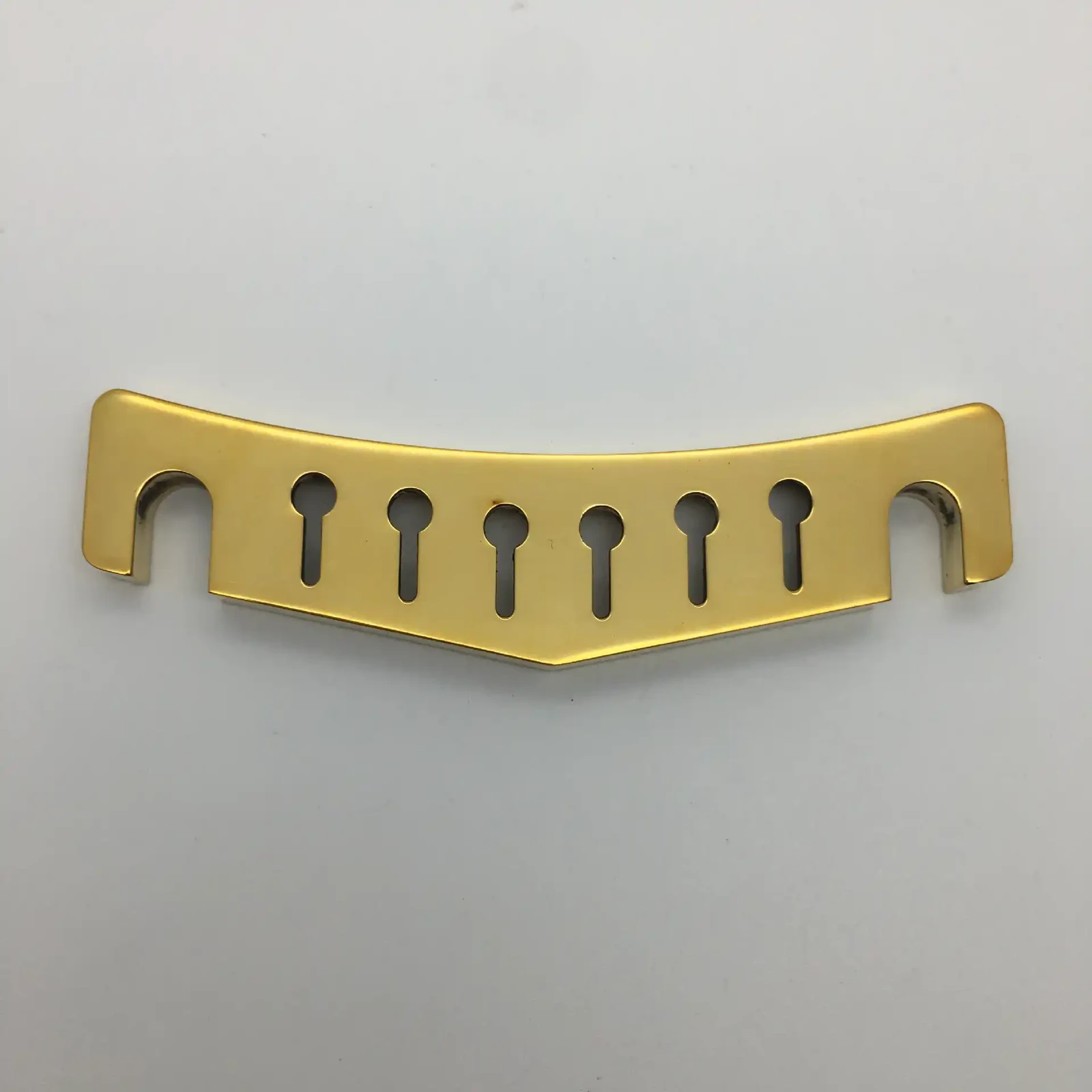 Curved brass component with milled slots