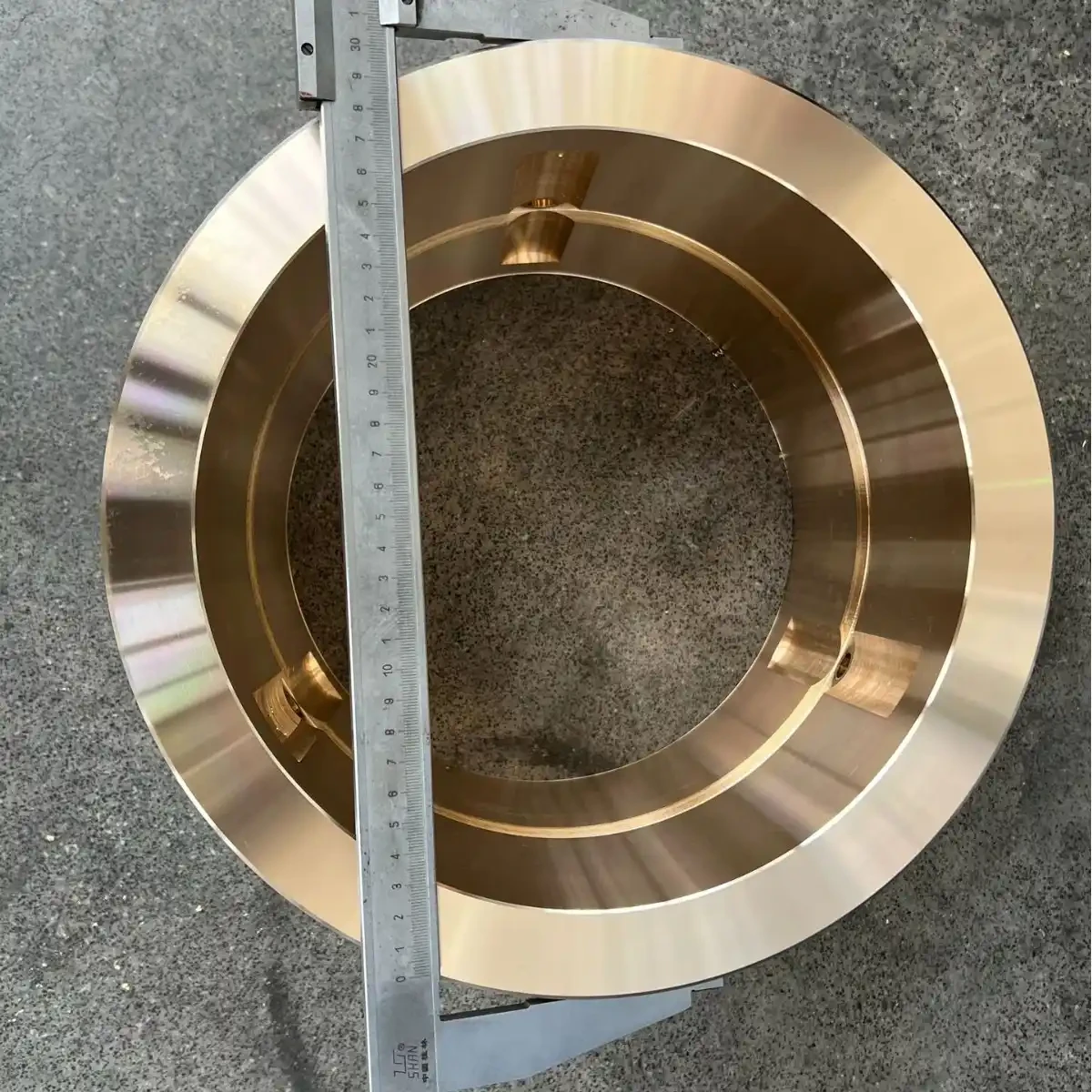 Machined bronze ring with a stepped bore