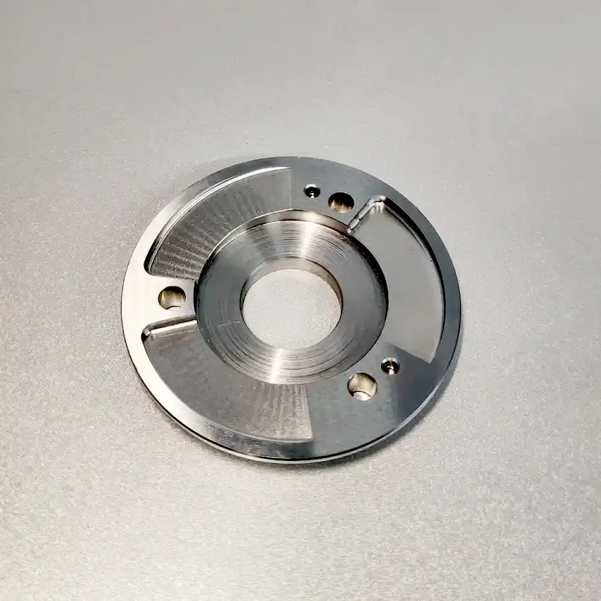 Machined nickel alloy circular flange with drilled holes