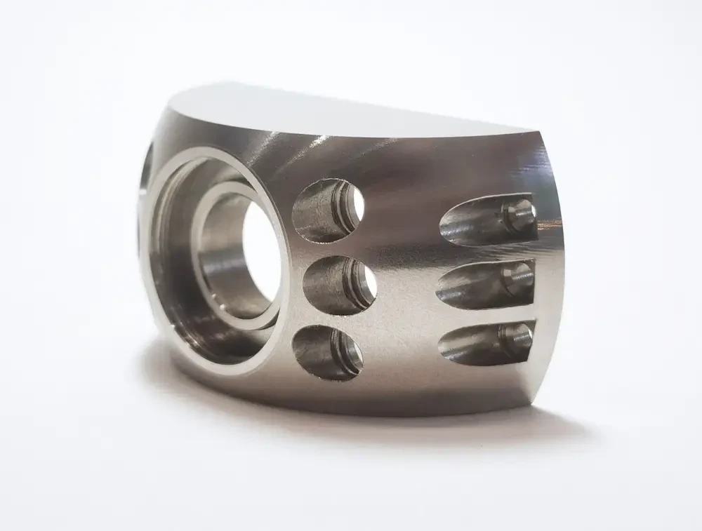 Nickel alloy component with milled slots and a precision bore