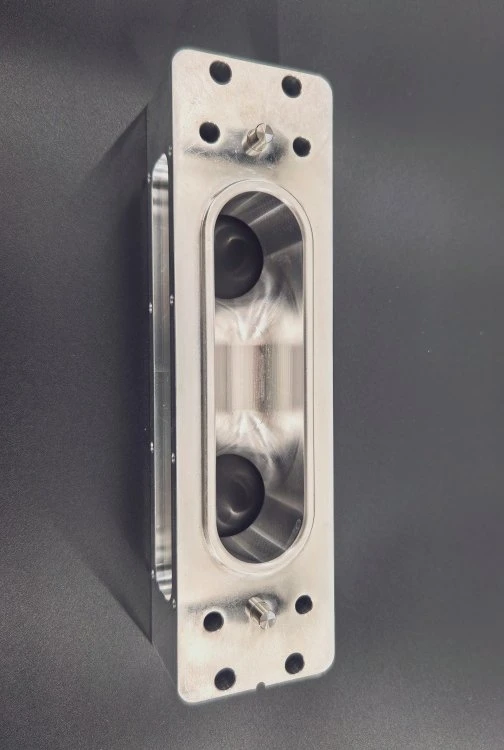 Machined housing with deep pockets and drilled features