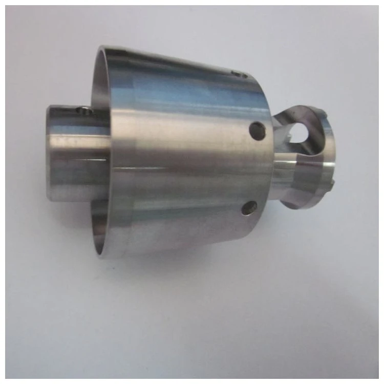 Turned titanium housing with a cross-drilled flange