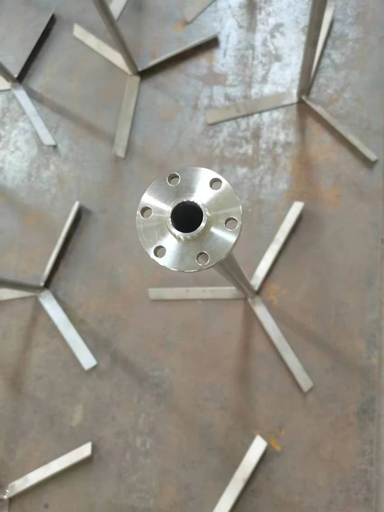 Titanium hub component with radial arms and drilled features
