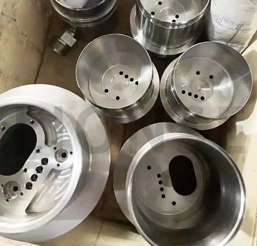 Titanium housings with milled and drilled features