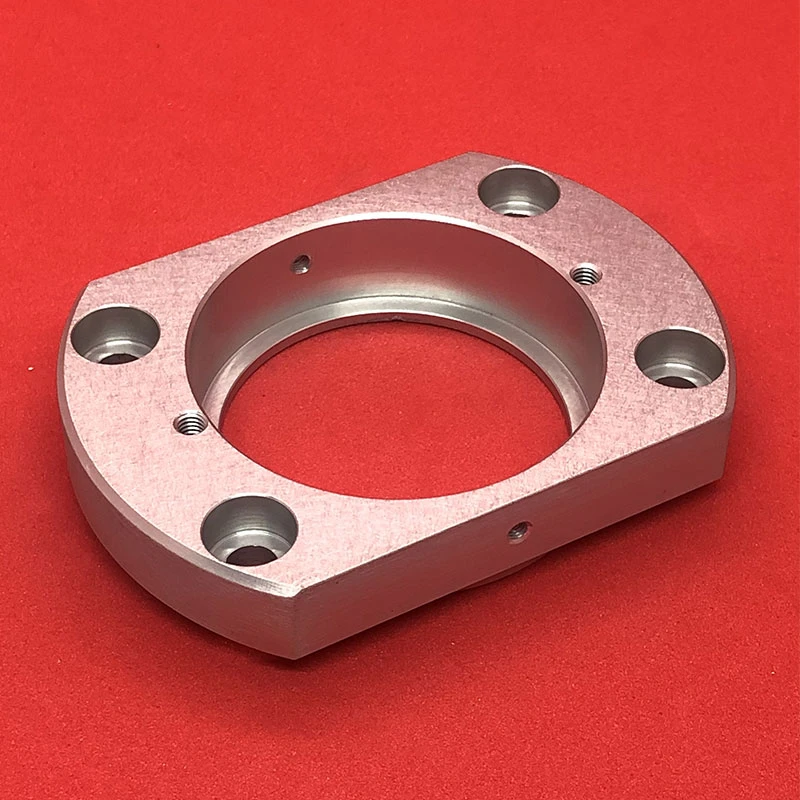 CNC machined finished aluminum housing with rounded corners and hole edges