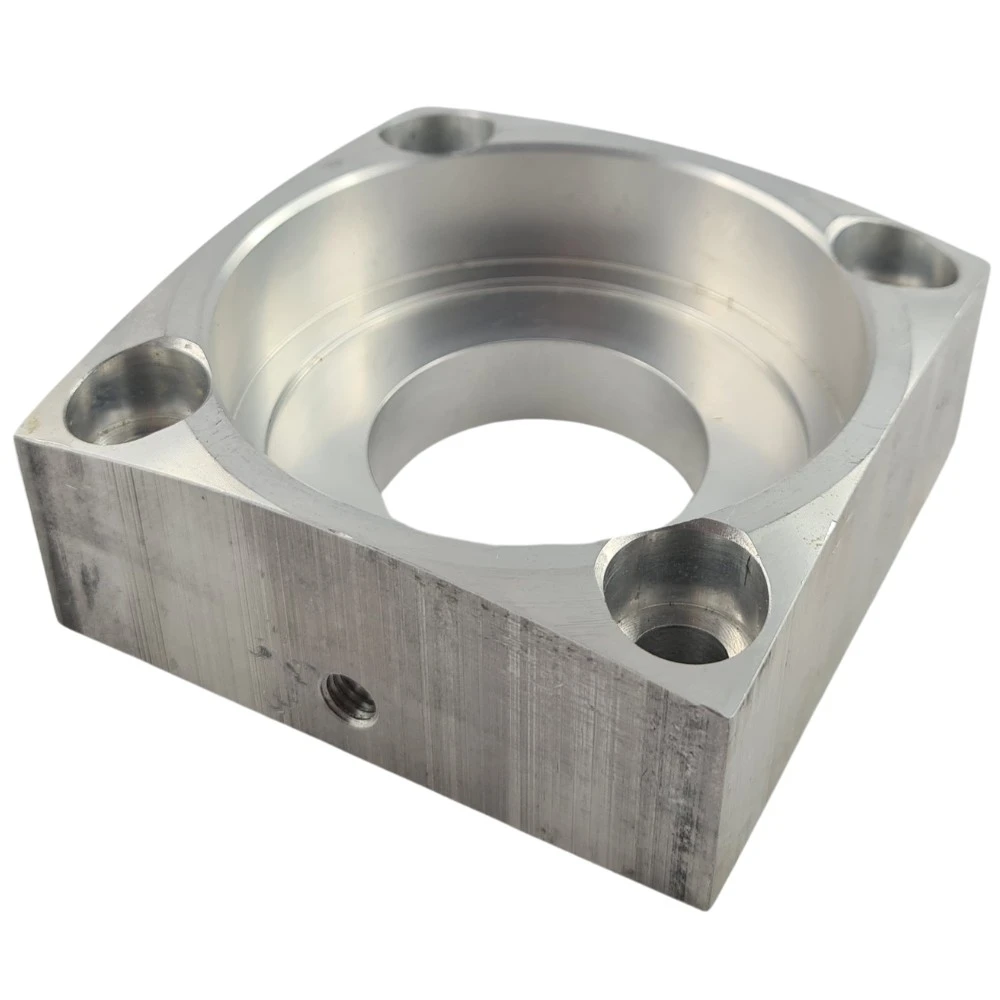 Machined bearing housing with a central bore and edge transitions